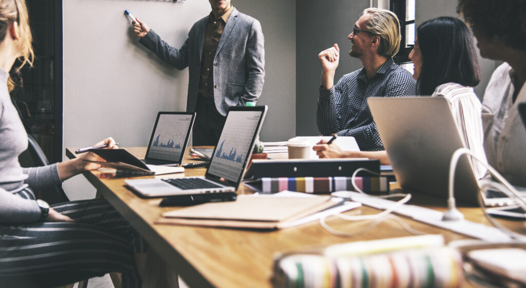 Top 5 Reasons DOOH Works for Local Businesses 1 group diverse people having business meeting